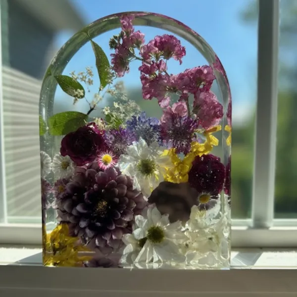 Arch-top pressed flower frame with a preserved wedding bouquet