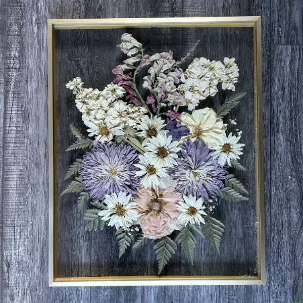 Large pressed flower frame filled with colorful preserved blooms