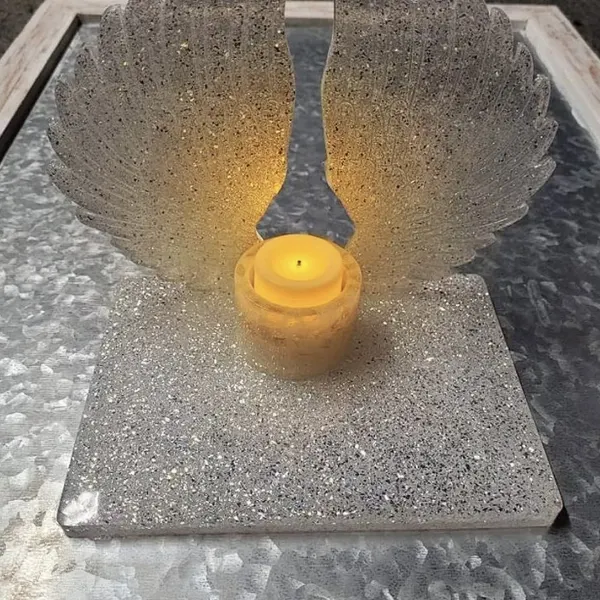 Angel wing memorial stand with preserved funeral flowers in resin