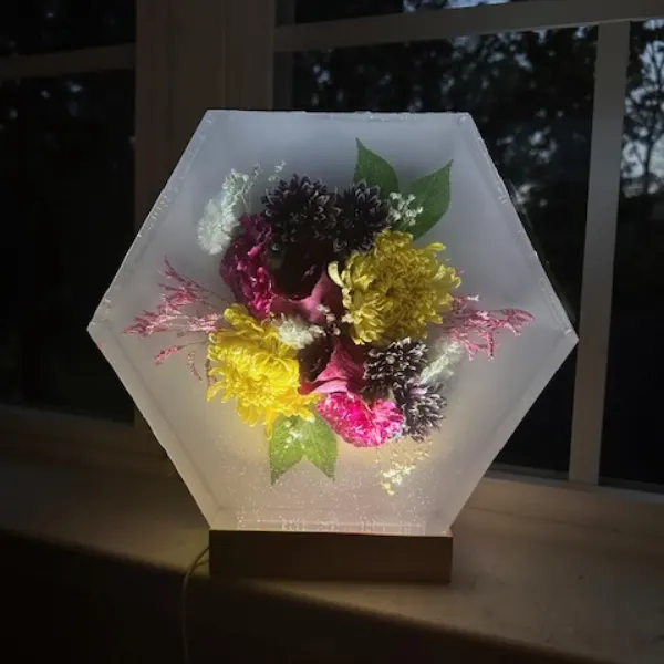 Large hexagon resin block with flowers suspended inside