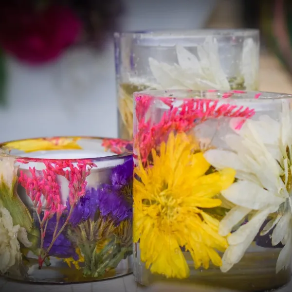 Resin candle holder glowing through petals